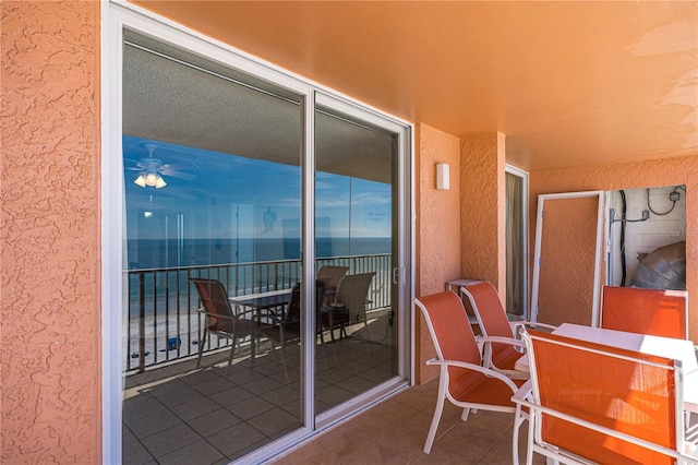 balcony featuring a water view