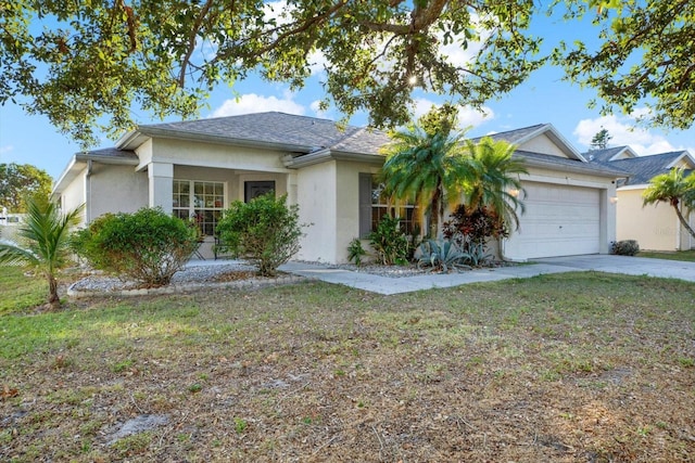 ranch-style house with a garage and a front yard