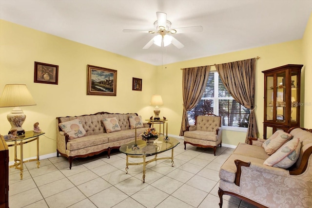 living room featuring ceiling fan and light tile patterned floors