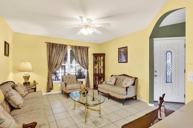 tiled living room with ceiling fan