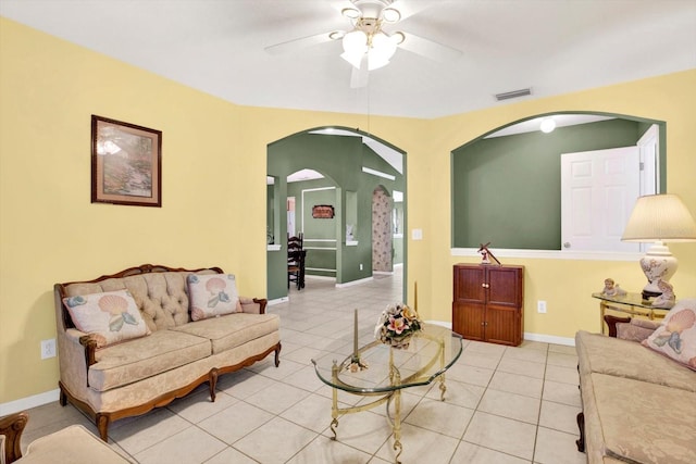 tiled living room featuring ceiling fan