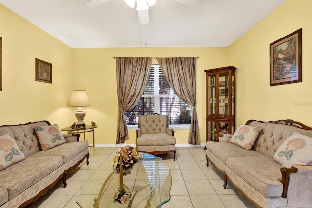 living room featuring light tile patterned floors and ceiling fan