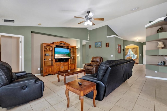 living room with light tile patterned floors, ceiling fan, and lofted ceiling