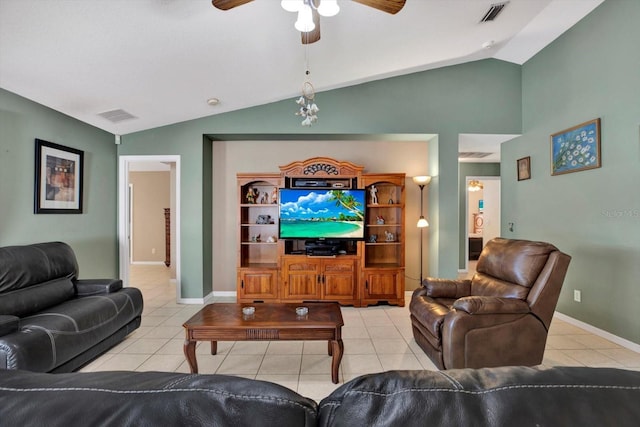 living room featuring ceiling fan, light tile patterned floors, and lofted ceiling