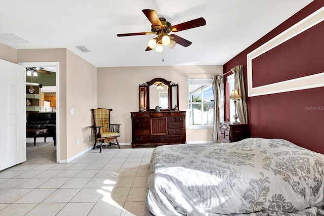 bedroom featuring ceiling fan and light tile patterned floors