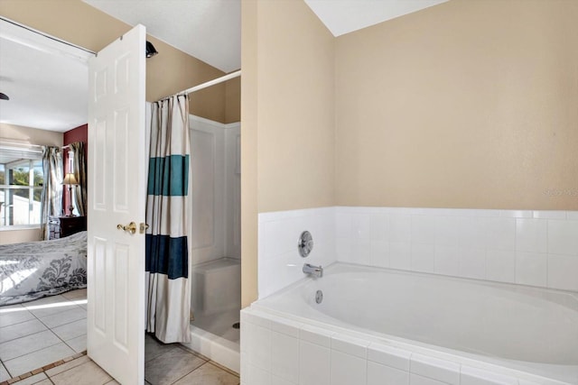 bathroom featuring tile patterned flooring and walk in shower