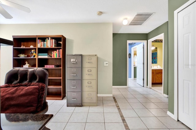 office space featuring ceiling fan and light tile patterned flooring