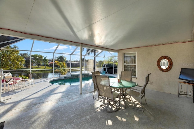 exterior space featuring a water view, a lanai, and a patio area