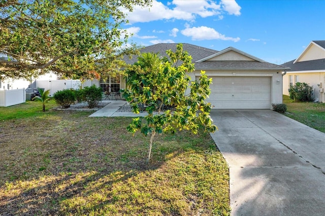 view of front of house with a garage and a front lawn