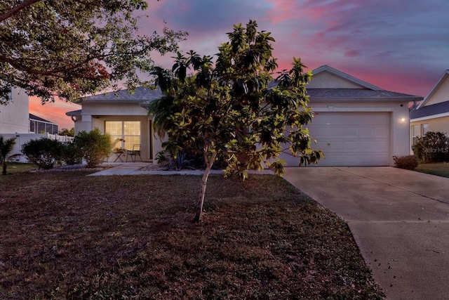 obstructed view of property with a garage