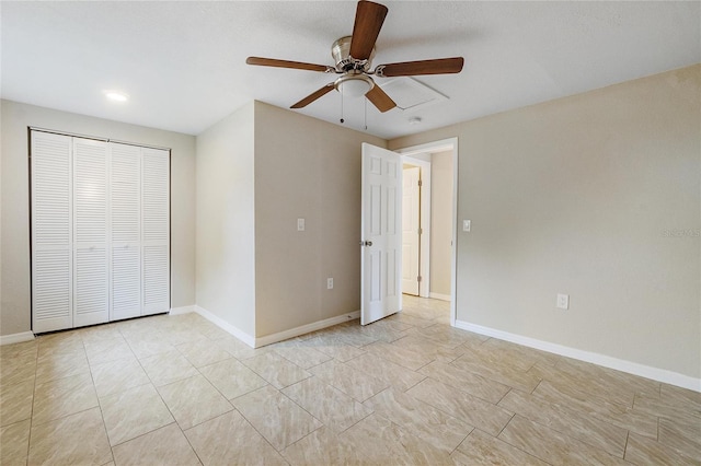 unfurnished bedroom featuring ceiling fan and a closet