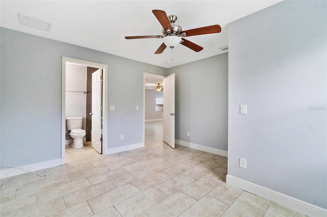 unfurnished bedroom featuring connected bathroom, ceiling fan, and light tile patterned flooring