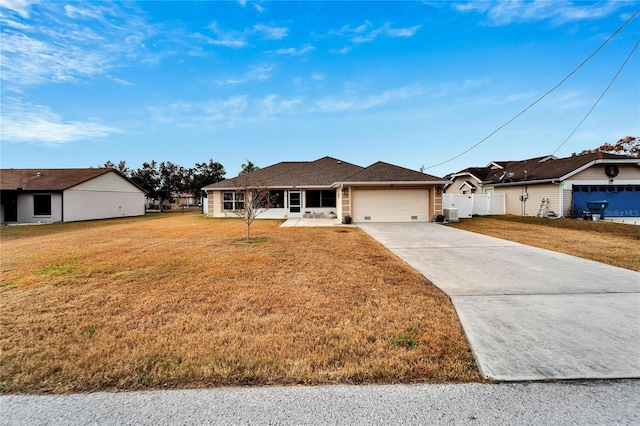 ranch-style house featuring a front yard and a garage