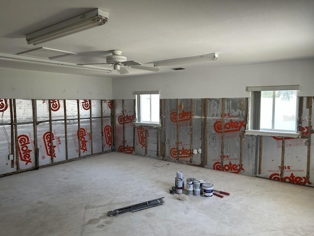 interior space featuring visible vents and ceiling fan