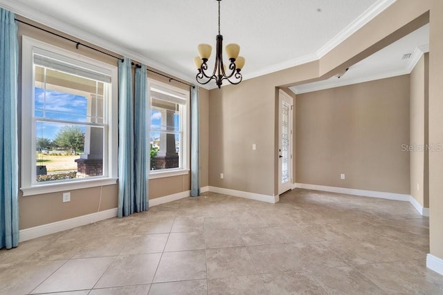 tiled empty room featuring a chandelier and ornamental molding