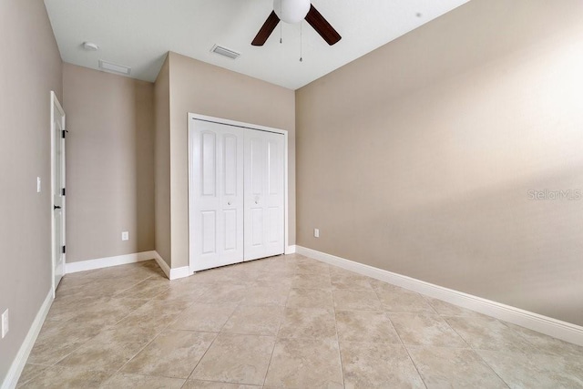 unfurnished bedroom with a closet and ceiling fan