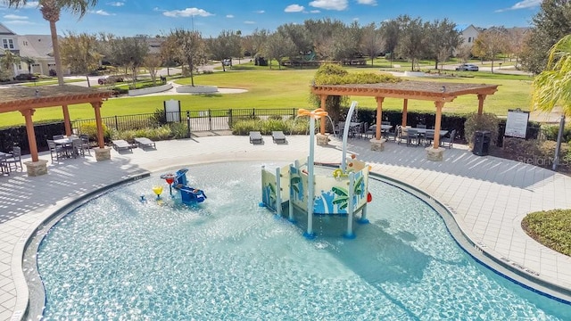 view of swimming pool with a pergola, a patio area, and a lawn