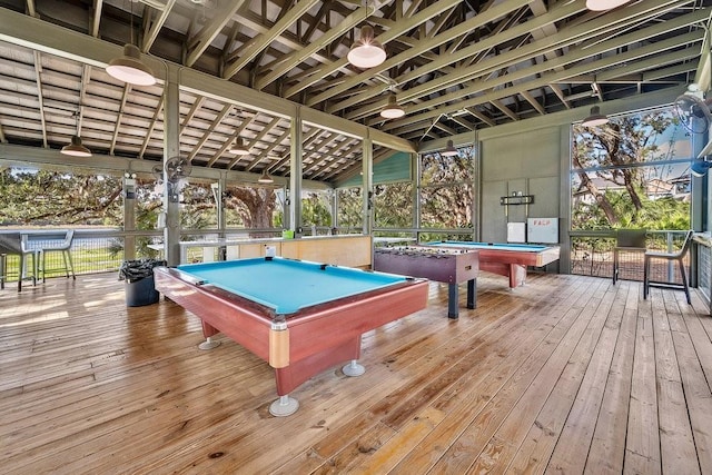 game room featuring light wood-type flooring, a healthy amount of sunlight, and billiards