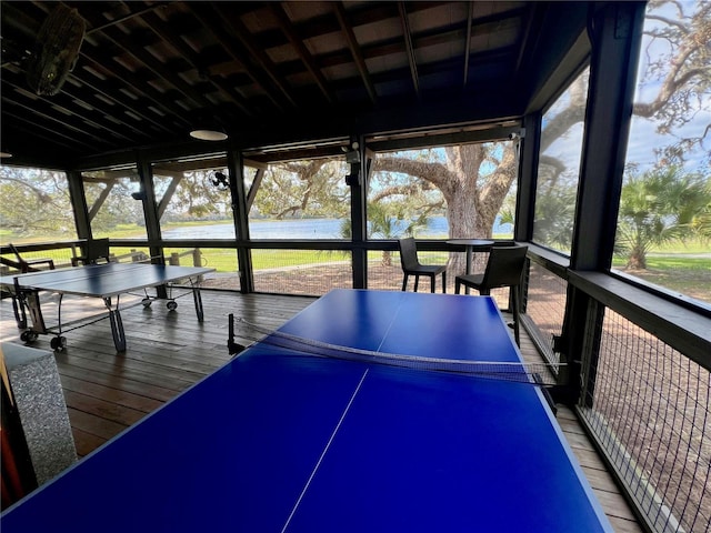 playroom featuring a water view and wood-type flooring