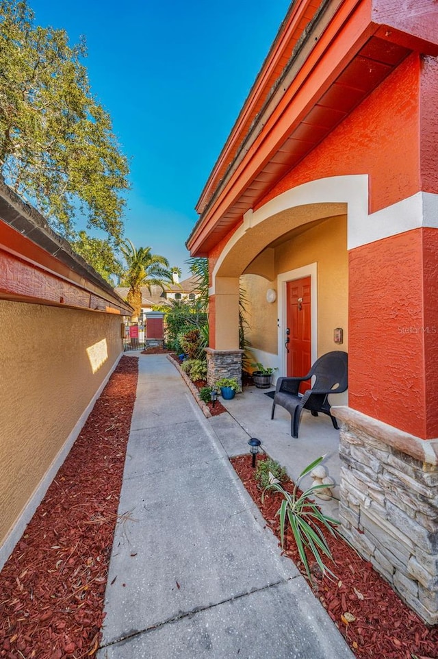 doorway to property with a patio area