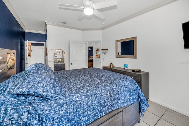 tiled bedroom with ceiling fan and ornamental molding