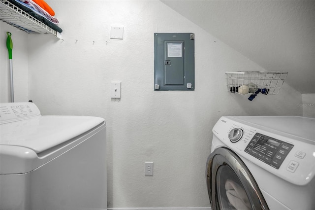 clothes washing area with electric panel and independent washer and dryer