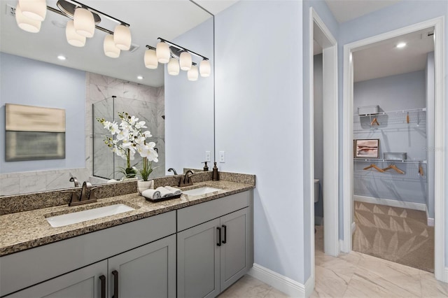 bathroom with vanity and walk in shower