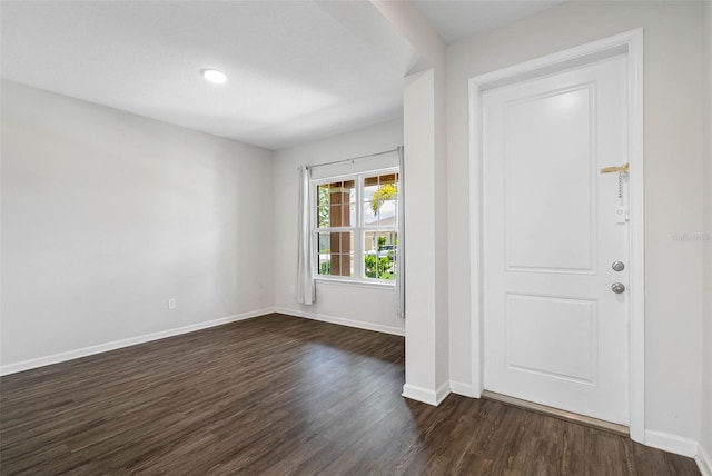 foyer entrance with dark wood-type flooring