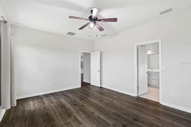 unfurnished bedroom featuring ceiling fan, dark hardwood / wood-style flooring, and ensuite bathroom