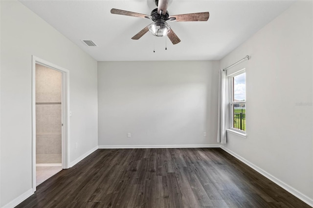 unfurnished room featuring dark hardwood / wood-style floors and ceiling fan