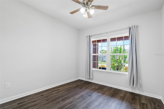 unfurnished room with dark hardwood / wood-style floors and ceiling fan