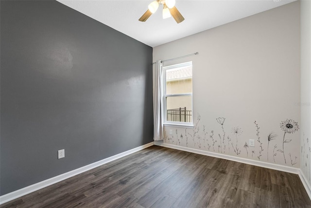 unfurnished room with ceiling fan and dark wood-type flooring