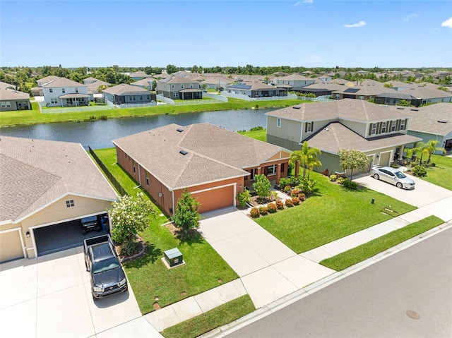 drone / aerial view with a water view