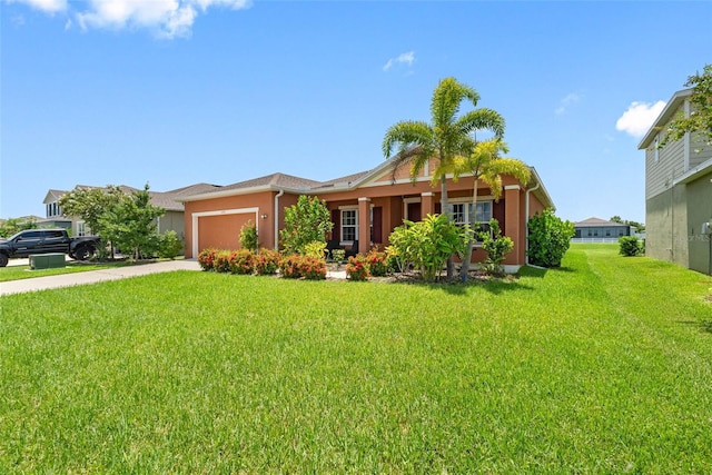 ranch-style home with a front yard and a garage