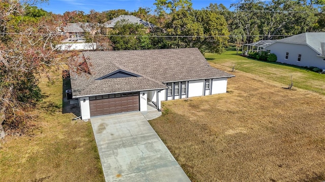 view of front of house featuring a garage and a front yard