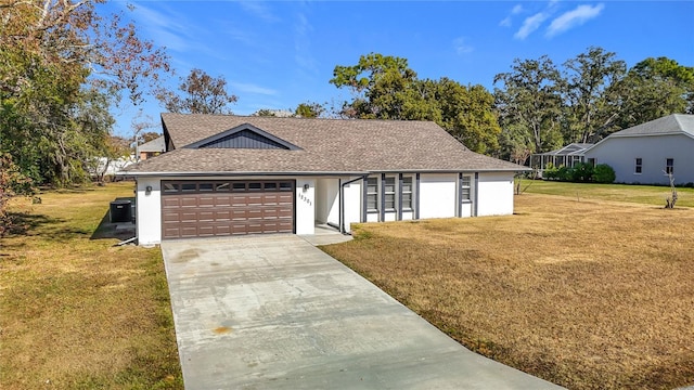 single story home featuring a front yard, central AC, and a garage