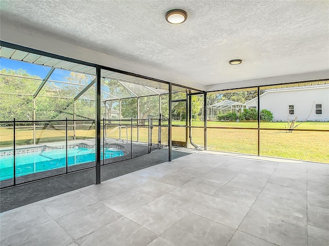 unfurnished sunroom with a pool and plenty of natural light