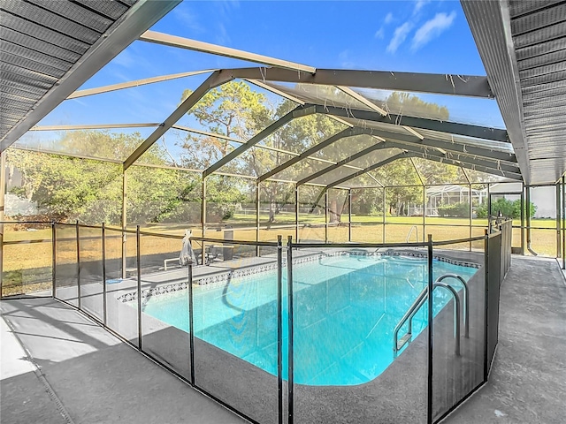 view of pool featuring a patio and glass enclosure