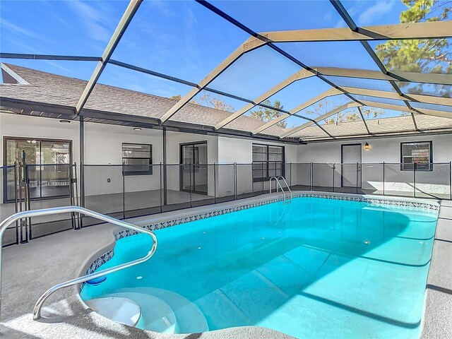 view of pool with a lanai and a patio