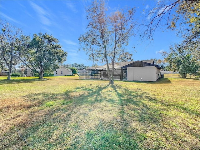 view of yard with a lanai