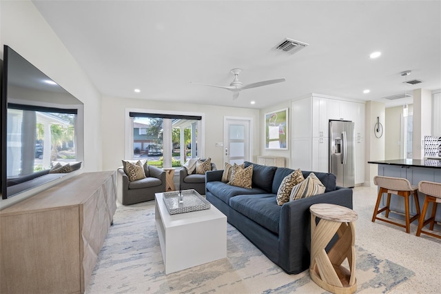 living room featuring ceiling fan