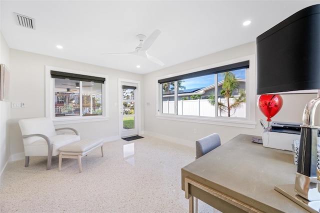 home office featuring plenty of natural light and ceiling fan