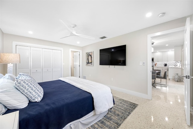 bedroom featuring ceiling fan and a closet