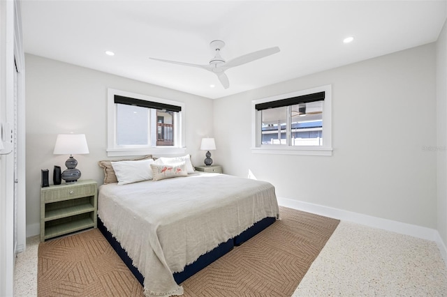 bedroom with multiple windows and ceiling fan