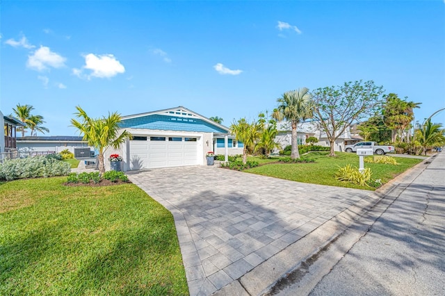 ranch-style house with a garage and a front yard