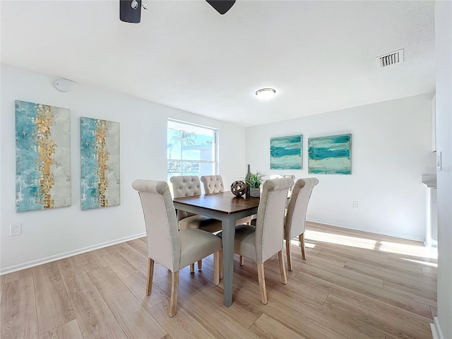 dining space featuring light hardwood / wood-style floors