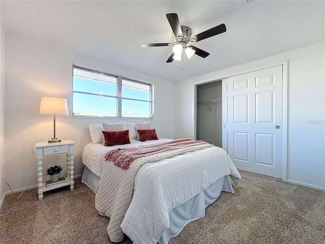 carpeted bedroom featuring ceiling fan and a closet