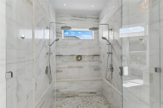 full bath featuring a marble finish shower