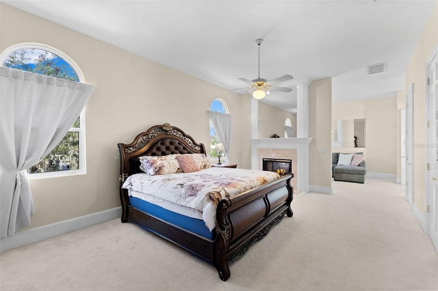 bedroom with carpet floors, multiple windows, and visible vents