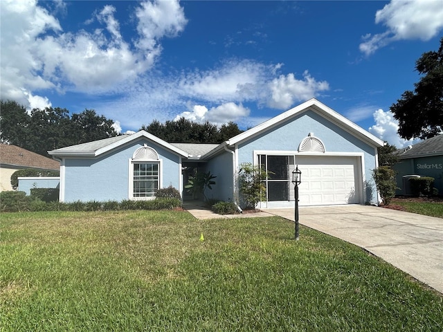 ranch-style home with a garage and a front lawn